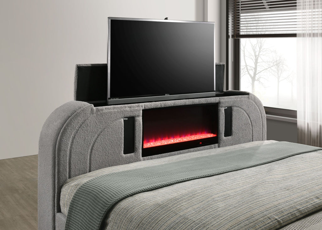 Close-up of Gray Sherpa Bed footboard with pop-up TV, red LED lighting, and Bluetooth speaker system for immersive entertainment.