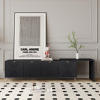 Modern black 70'-90' extendable TV cabinet with geometric textured doors and gold legs, styled in a living room with minimalist decor.