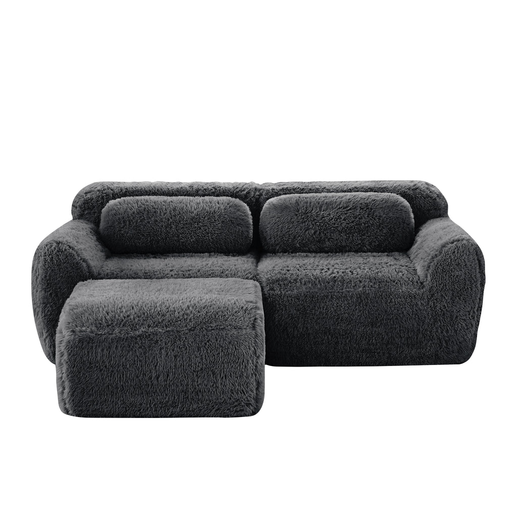 Front view of L-Shaped Sectional Sofa - Modular Plush in dark grey, showcasing its plush texture and ergonomic seating layout.