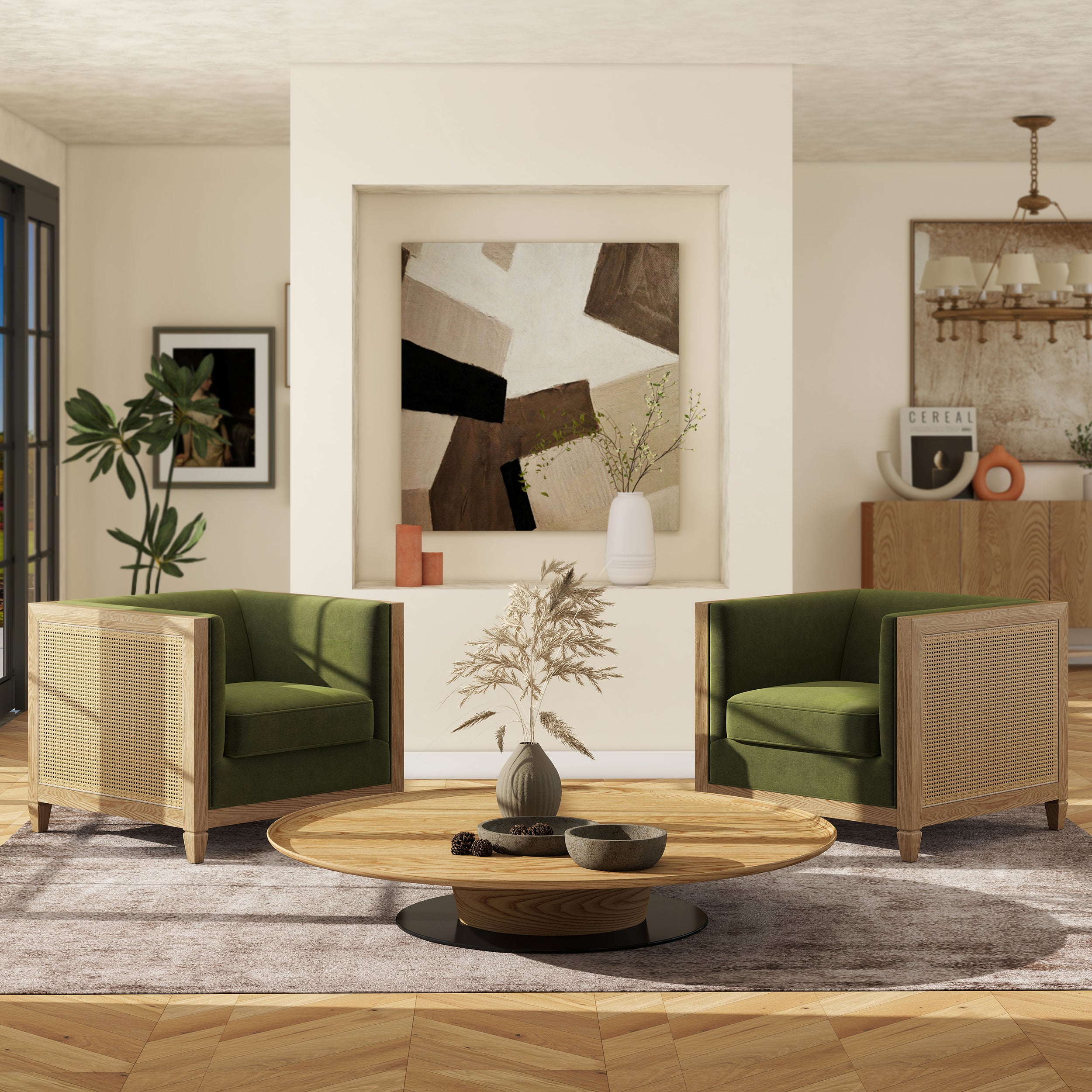 Two tuxedo armchairs in olive green performance velvet with natural cane rattan side panels and wood frames.
