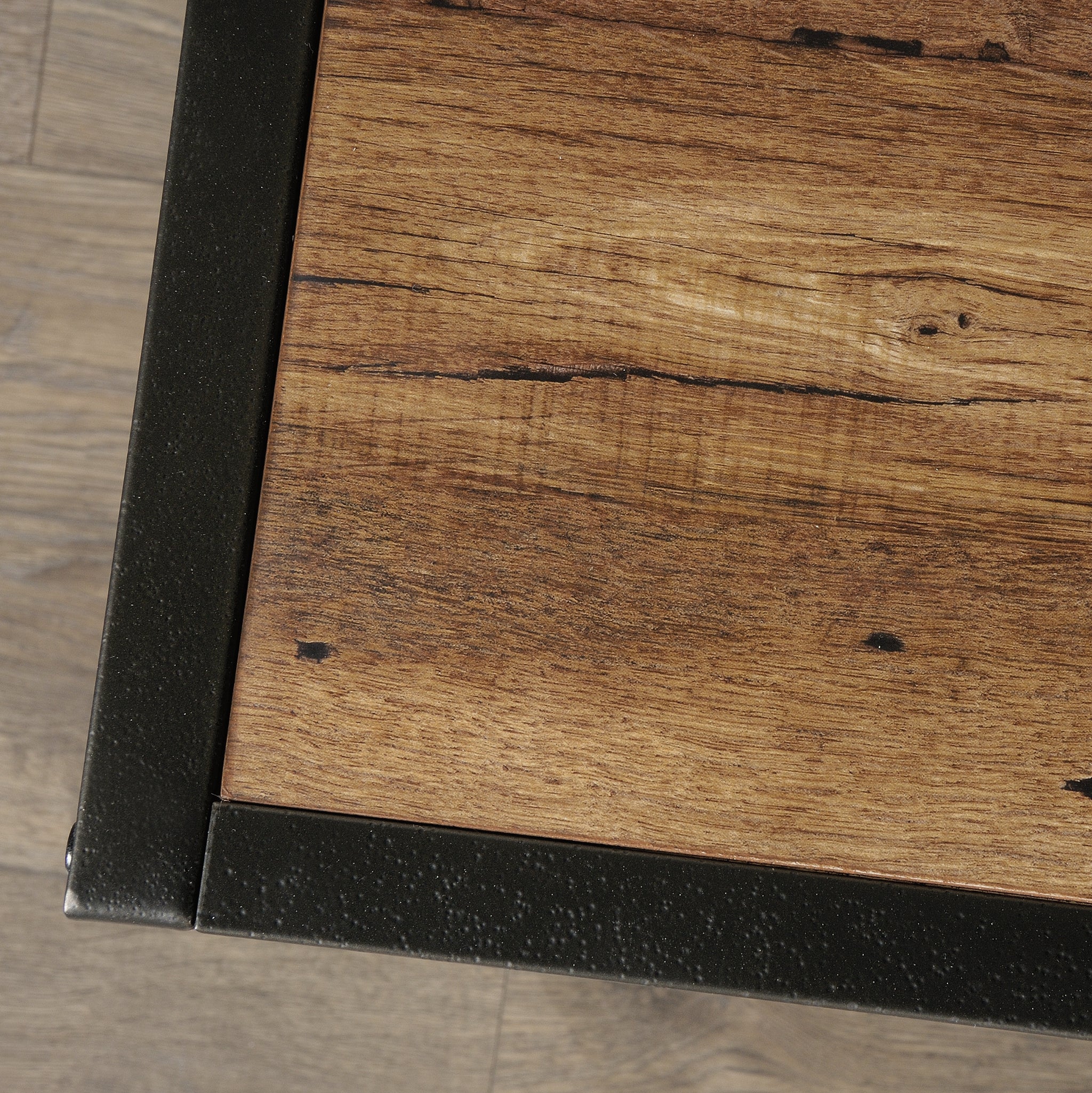 Top surface detail of Industrial Brown TV Credenza showing rustic wood grain and black metal trim for a modern industrial style.