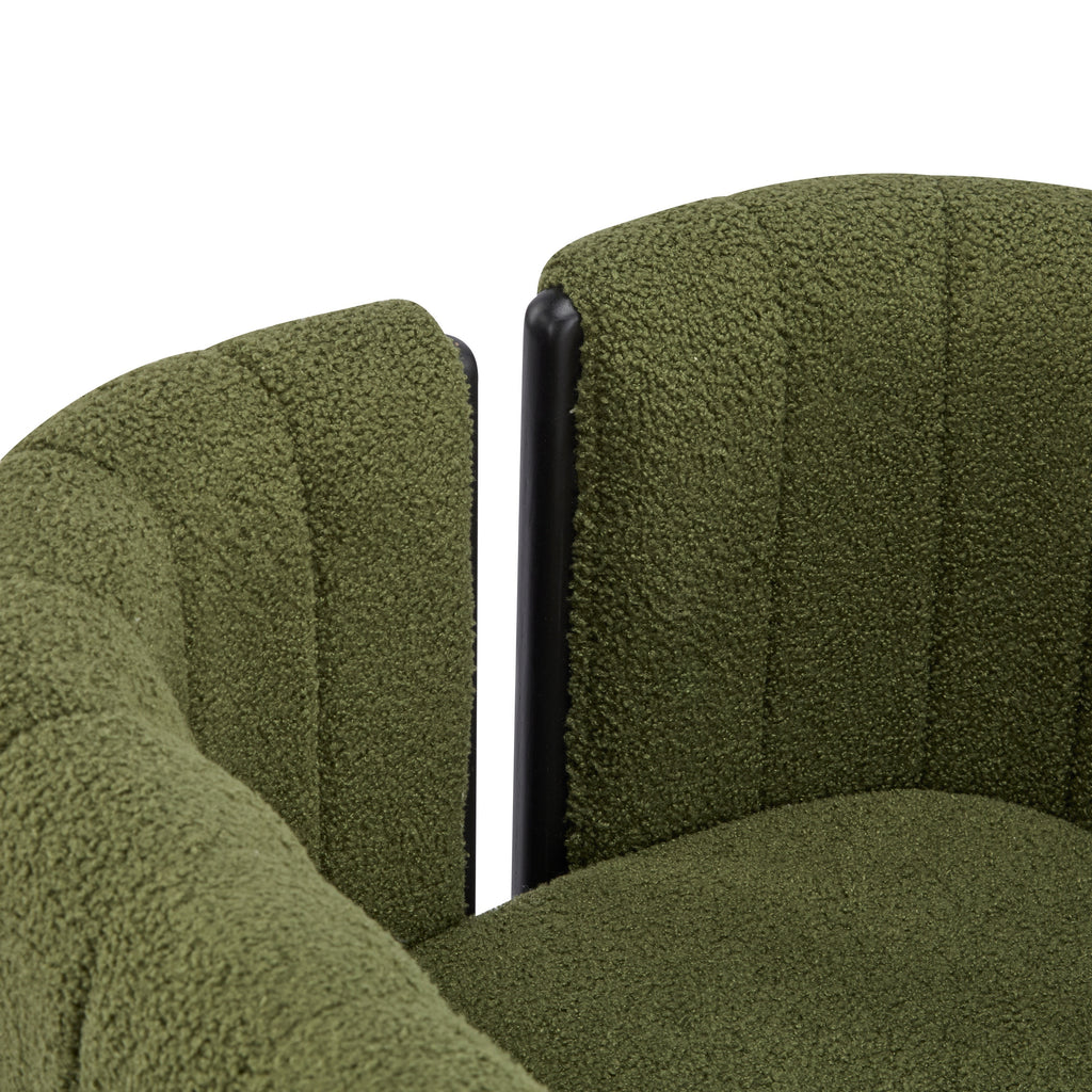 Detail of curved backrest and plush olive green boucle fabric on modern dining chair, highlighting its cozy and modern design.