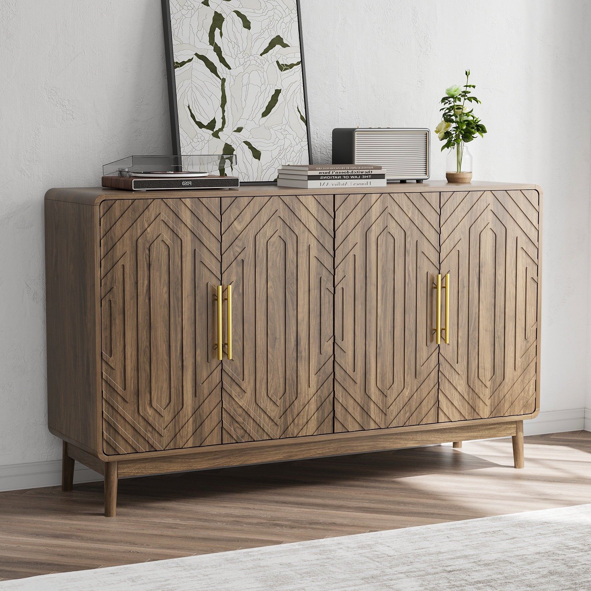 Contemporary walnut sideboard with gold handles and geometric door design, styled in a minimalist room with natural lighting.