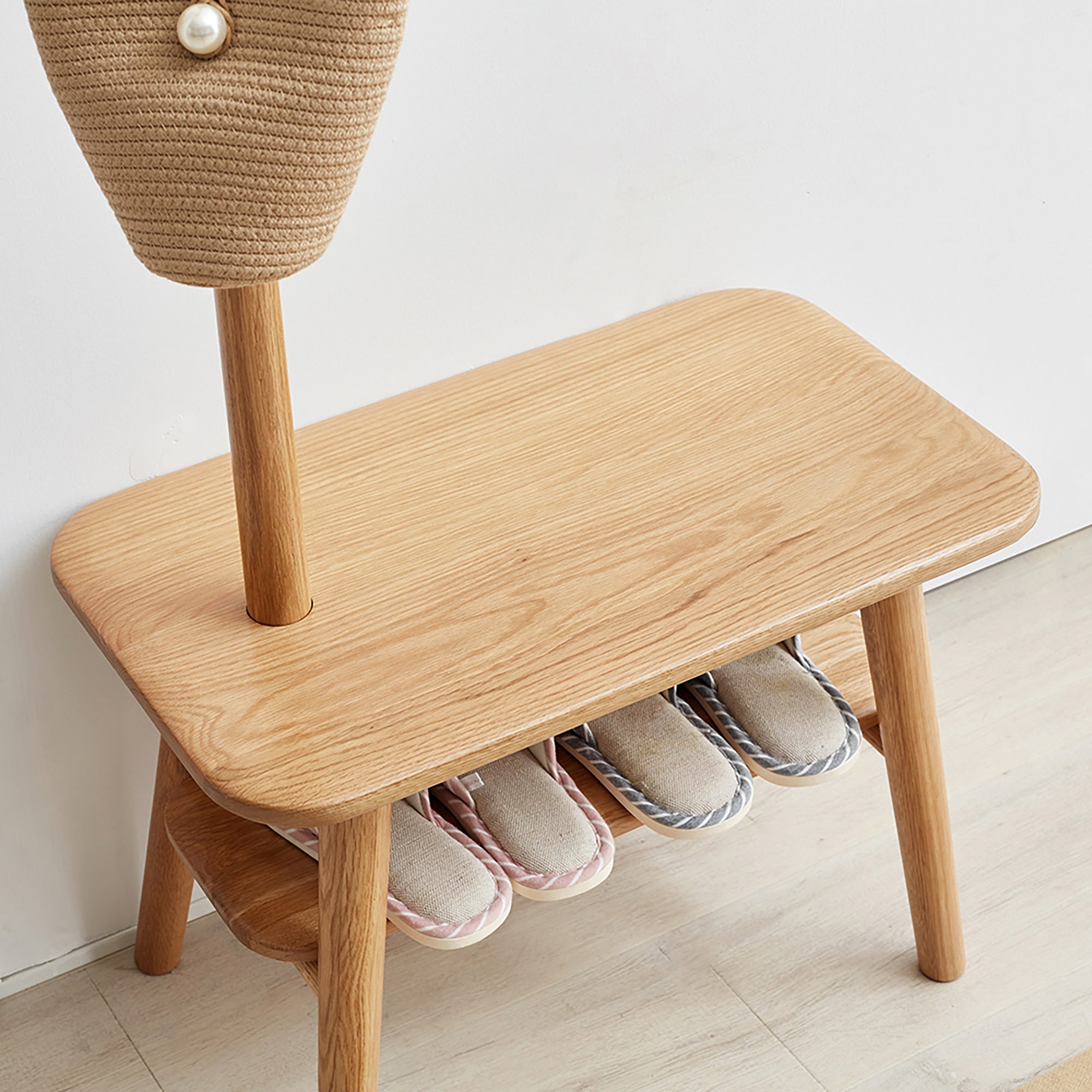Storage bench of Solid Wood Shoe Stool with slippers neatly arranged underneath, ideal for organized entryway shoe storage.