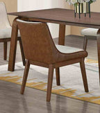 Back view of Mid-Century Modern Side Chair in dining room setup, showcasing walnut finish and padded upholstery for comfort and style.