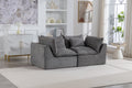 Oversized modular sectional couch in antique grey velvet with plush cushions, styled in a modern living room with natural light and decor.