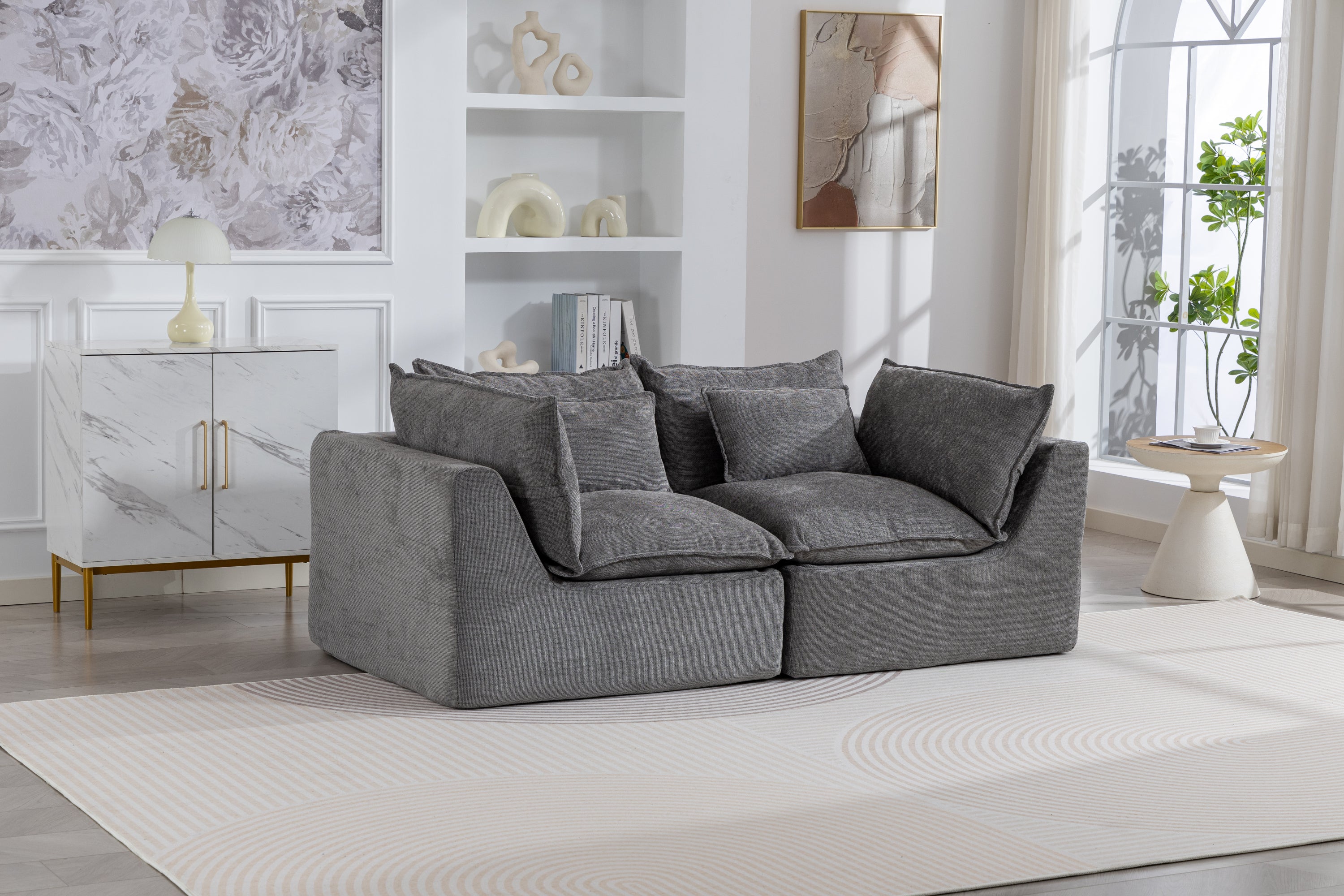 Oversized modular sectional couch in antique grey velvet with plush cushions, styled in a modern living room with natural light and decor.