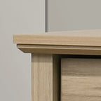 Top corner detail of Elara Light Oak Dresser emphasizing the beveled edge and quality craftsmanship.
