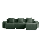 Front view of green velvet modular sectional sofa with three seats and ottoman, designed for comfort and easy setup.