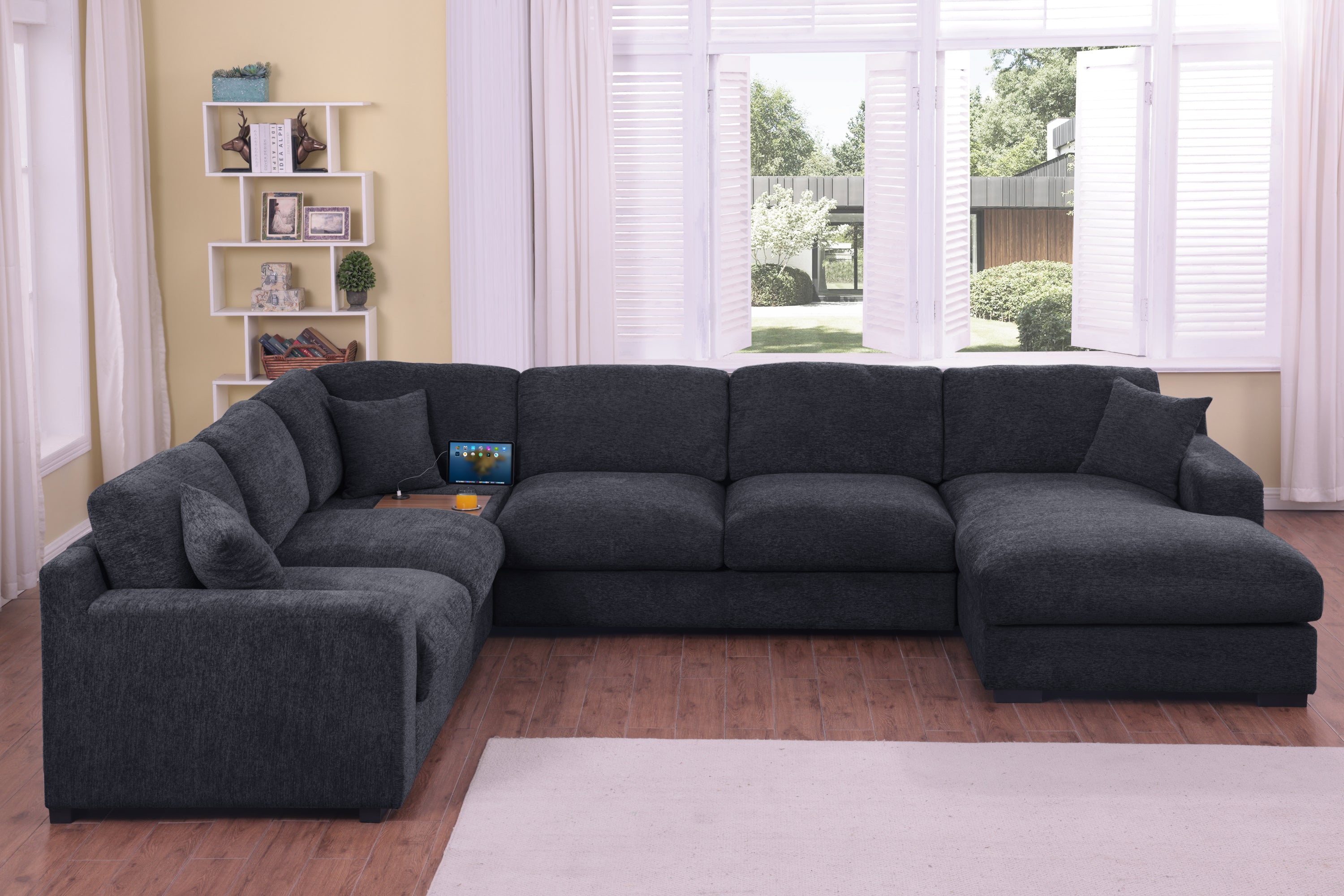 Front view of the Celine Corner Sofa - Charcoal Sofa with Chaise, highlighting its spacious seating and built-in tech features.