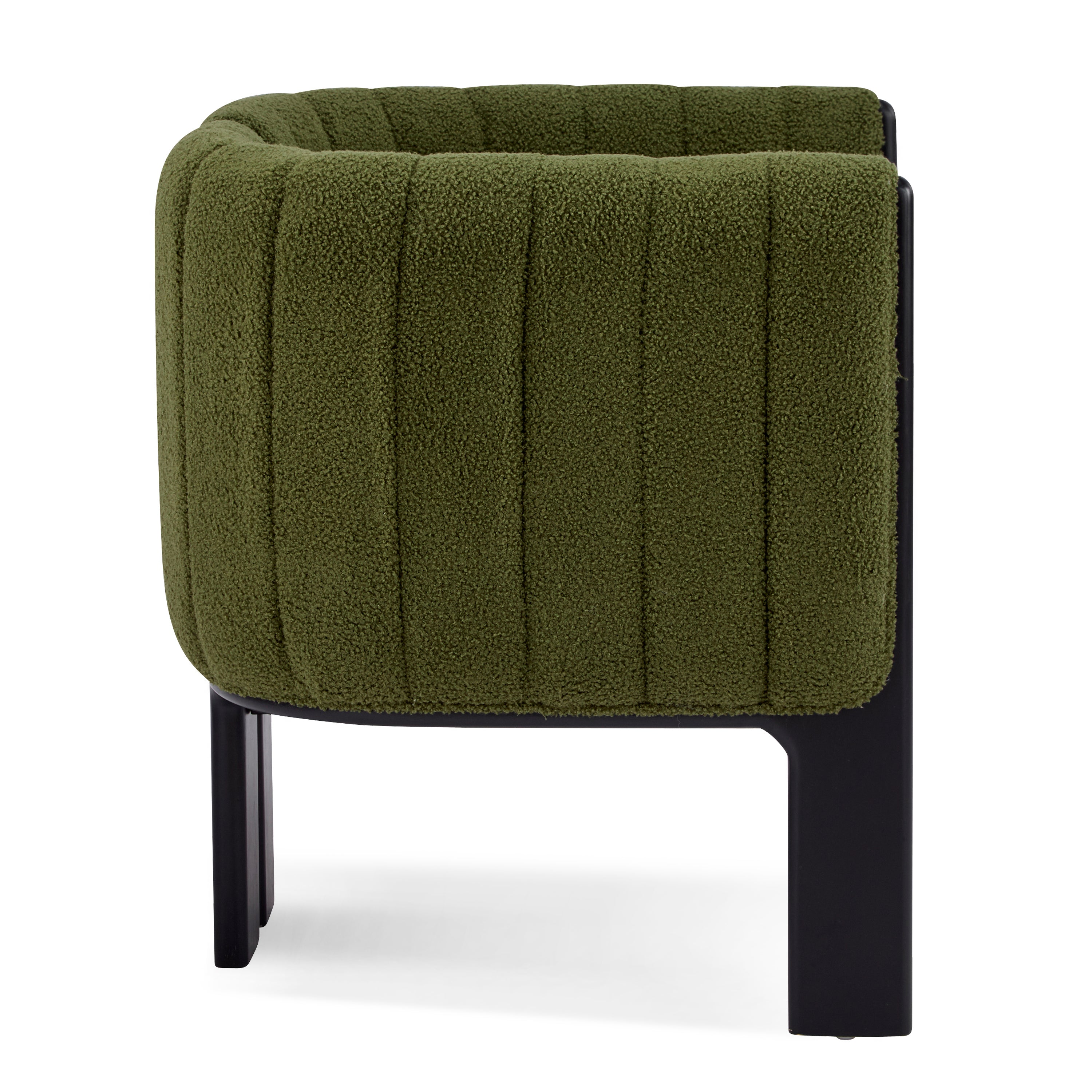 Side profile of a modern dining chair with plush olive green fabric and black rubber wood legs, showcasing its curved backrest.