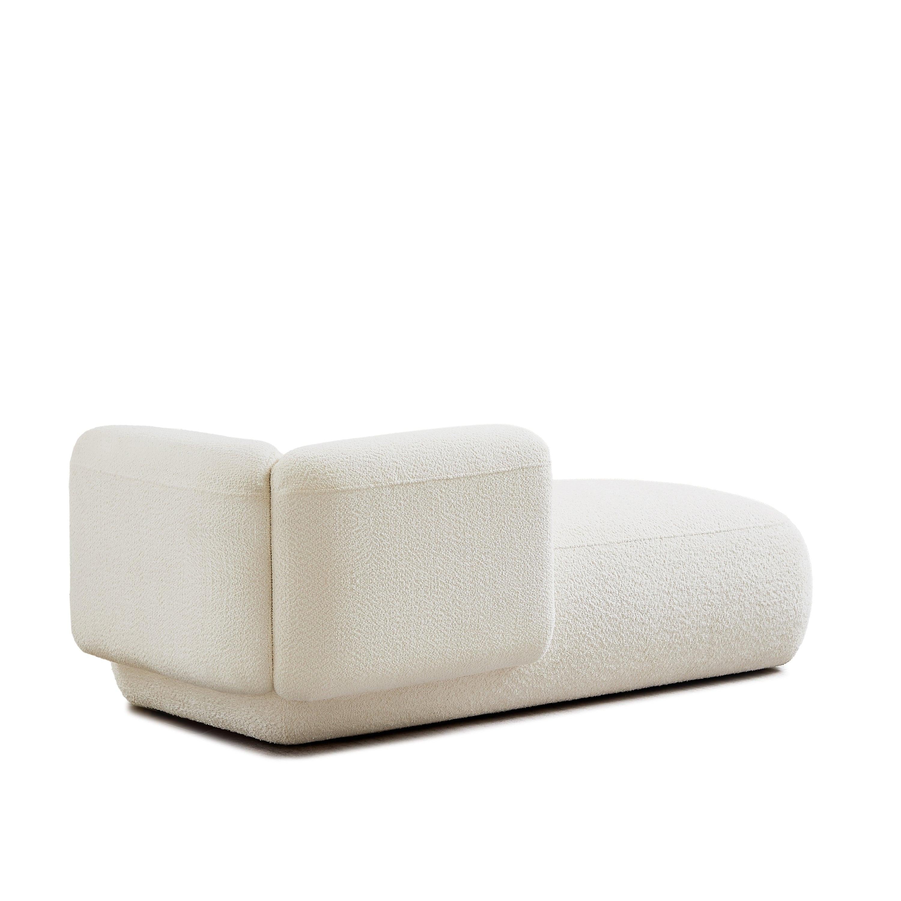 Stylish Upholstered Chaise Lounge for Relaxation.
