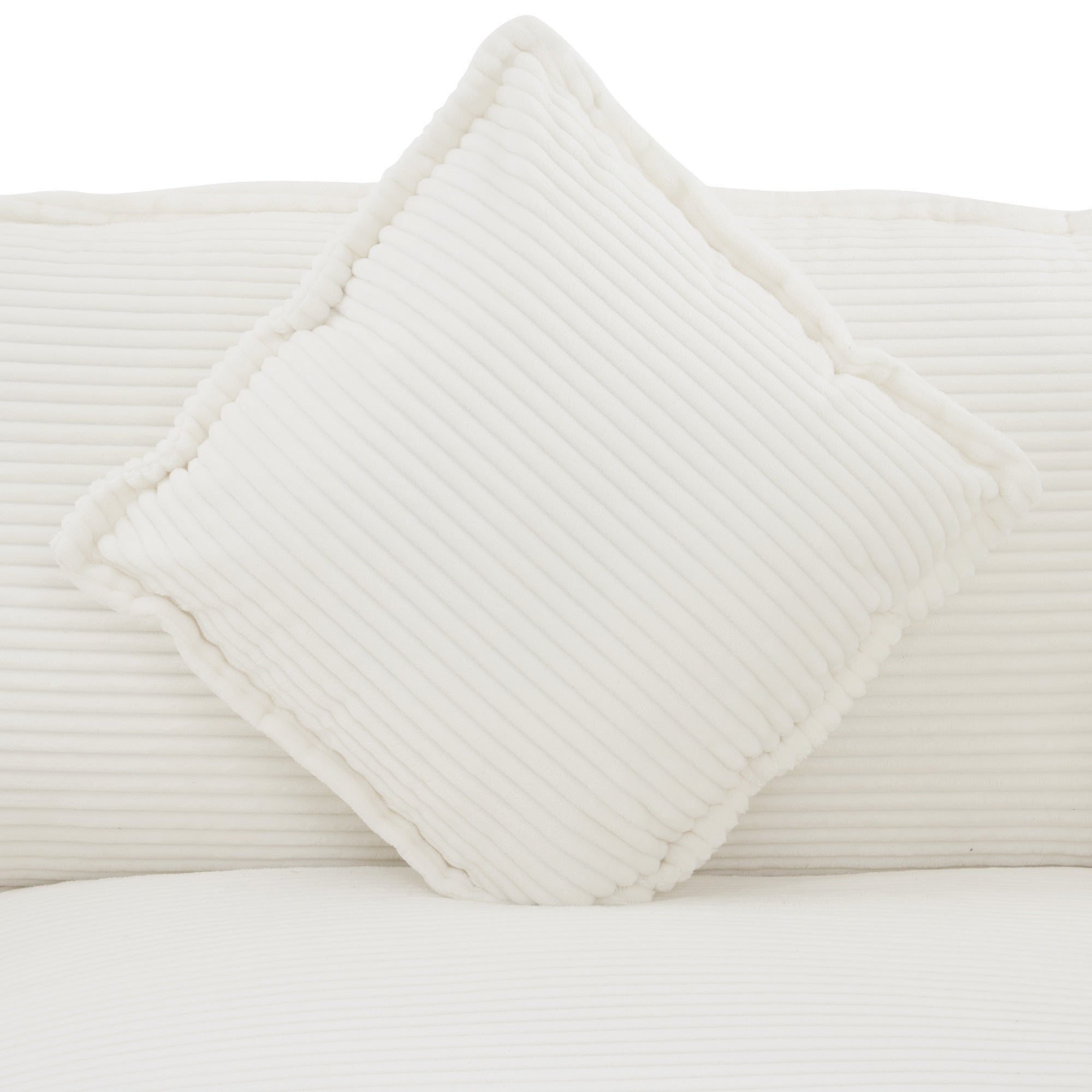 Square pillow detail from Modular Corduroy Sofa Beige - Stylish and Comfortable, featuring plush corduroy fabric and piped edges.