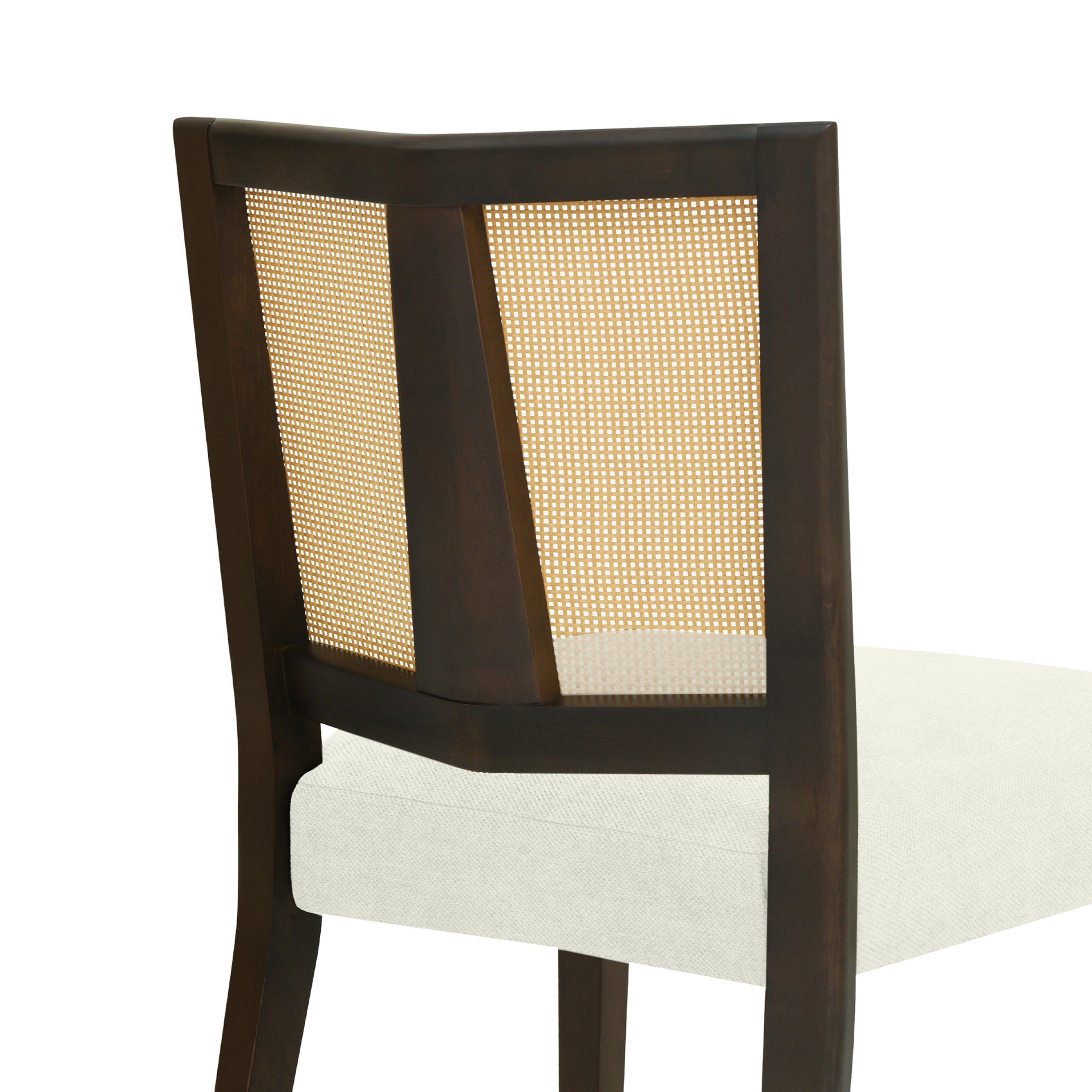 Detail of the back of Rattan Dining Chair showing angled wood frame and woven cane insert for a durable and elegant look.